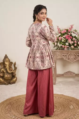 Rust red floral printed peplum kurti with matching flared palazzo set