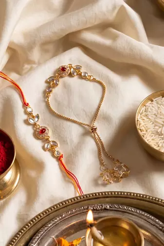 set of 2 kundan studded gold toned bhaiya bhabhi rakhi with roli chawal chandan mishri
