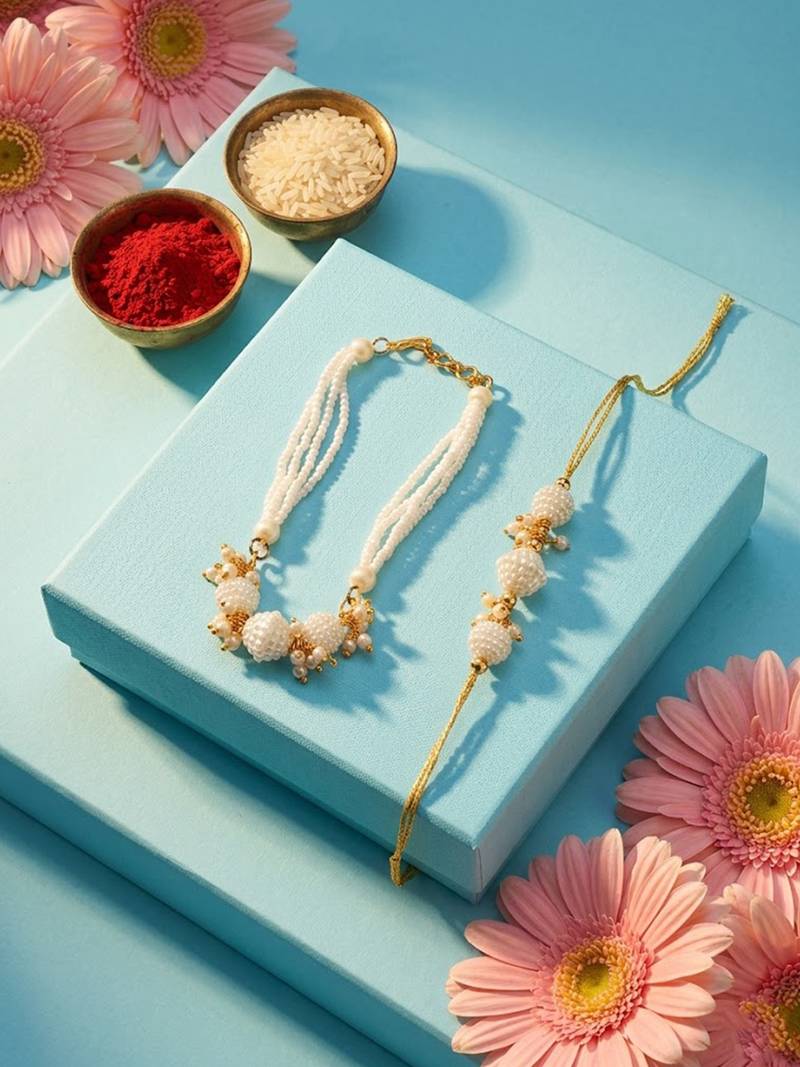 set of 2 gold toned & white pearls bhaiya bhabhi rakhi with roli chawal chandan mishri