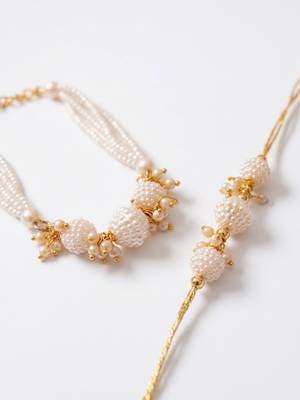 set of 2 gold toned & white pearls bhaiya bhabhi rakhi with roli chawal chandan mishri 3