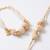 set of 2 gold toned & white pearls bhaiya bhabhi rakhi with roli chawal chandan mishri
