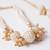 set of 2 gold toned & white pearls bhaiya bhabhi rakhi with roli chawal chandan mishri