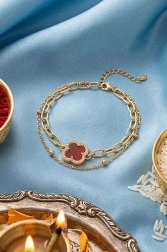 women artrificial stones gold plated rakhi with roli chawal chandan mishri