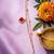 women artrificial stones gold plated rakhi with roli chawal chandan mishri