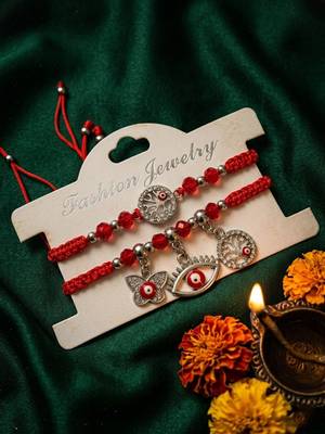 set of 2 red & silver evil eye design bhaiya bhabhi rakhi with roli chawal chandan 2
