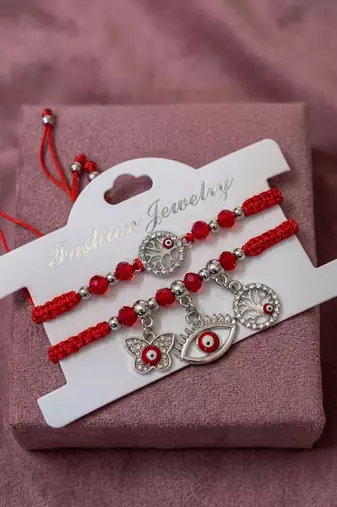 set of 2 red & silver evil eye design bhaiya bhabhi rakhi with roli chawal chandan