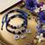 set of 2 blue & silver evil eye design bhaiya bhabhi rakhi with roli chawal chandan