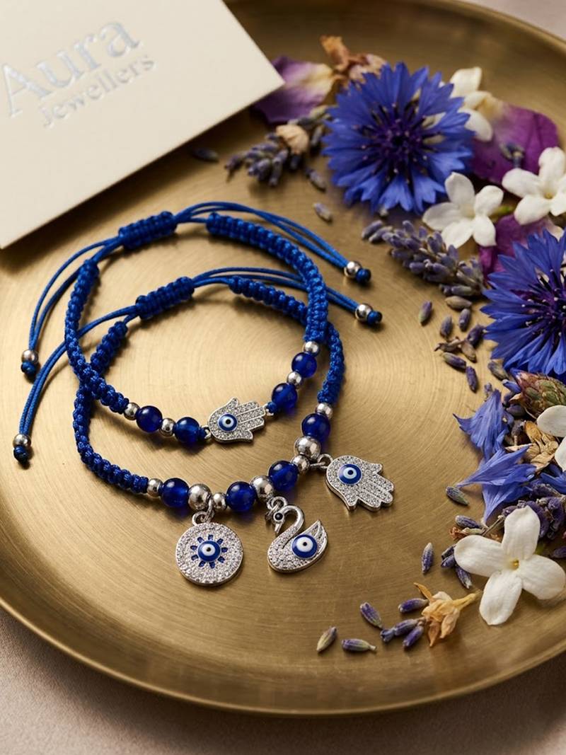 set of 2 blue & silver evil eye design bhaiya bhabhi rakhi with roli chawal chandan