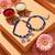 set of 2 blue & silver evil eye design bhaiya bhabhi rakhi with roli chawal chandan