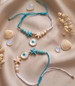 set of 2 blue evil eye & white pearl bhaiya bhabhi rakhi with roli chawal chandan