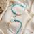 set of 2 blue evil eye & white pearl bhaiya bhabhi rakhi with roli chawal chandan