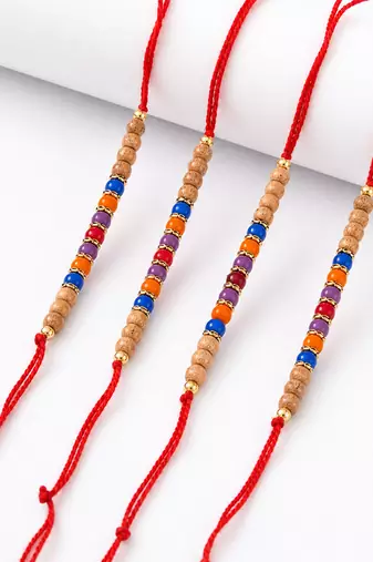 set of 4 multicolor circular beads studded thread rakhi with roli chawal chandan
