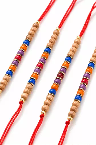 set of 4 multicolor circular beads studded thread rakhi with roli chawal chandan