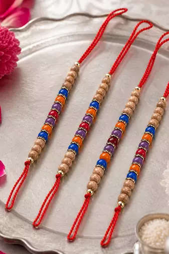 set of 4 multicolor circular beads studded thread rakhi with roli chawal chandan