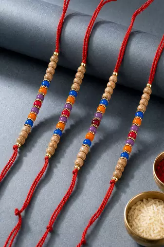 set of 4 multicolor circular beads studded thread rakhi with roli chawal chandan