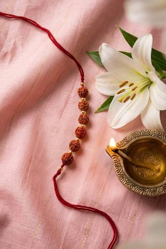 religious rudraksh thread rakhi with roli chawal chandan mishri