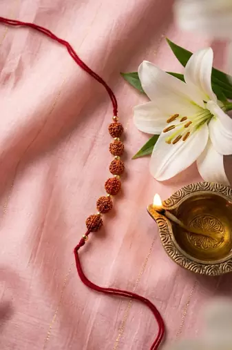 religious rudraksh thread rakhi with roli chawal chandan mishri