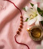 religious rudraksh thread rakhi with roli chawal chandan mishri