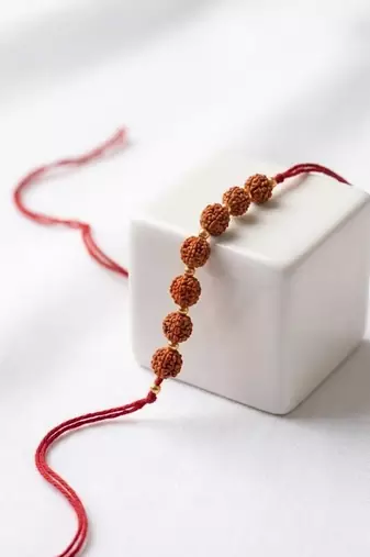 religious rudraksh thread rakhi with roli chawal chandan mishri