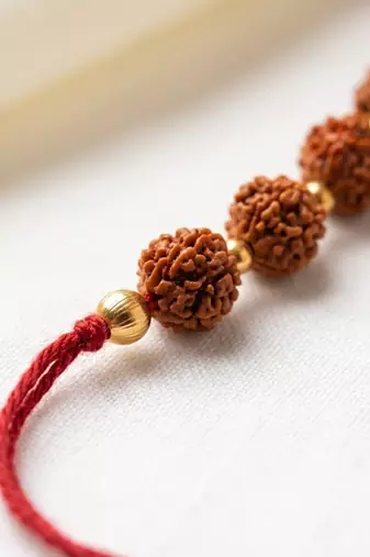 religious rudraksh thread rakhi with roli chawal chandan mishri