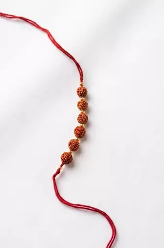 religious rudraksh thread rakhi with roli chawal chandan mishri