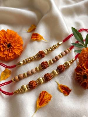 set of 3 religious rudraksh red thread rakhi with roli chawal chandan mishri 1