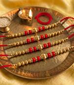 set of 4 artificial beads red thread rakhi with roli chawal chandan mishri