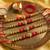 set of 4 artificial beads red thread rakhi with roli chawal chandan mishri