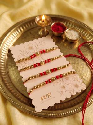 set of 4 artificial beads red thread rakhi with roli chawal chandan mishri 5