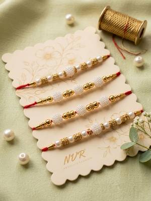 set of 4 white pearls & red thread rakhi with roli chawal chandan mishri 1