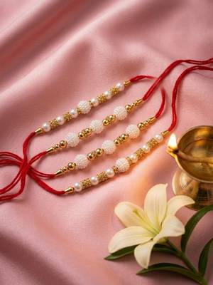 set of 4 white pearls & red thread rakhi with roli chawal chandan mishri 2