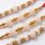set of 4 white pearls & red thread rakhi with roli chawal chandan mishri