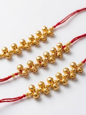 set of 3 gold toned ghungroo & red thread rakhi with roli chawal chandan mishri 3