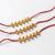 set of 3 gold toned ghungroo & red thread rakhi with roli chawal chandan mishri
