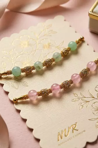set of 2 pink & green artificial beads thread rakhi with roli chawal chandan mishri