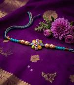artificial beads flower shape multicolor thread rakhi with roli chawal chandan mishri