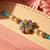 artificial beads flower shape multicolor thread rakhi with roli chawal chandan mishri