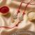 set of 2 red kundan studded floral design bhaiya bhabhi rakhi with roli chawal