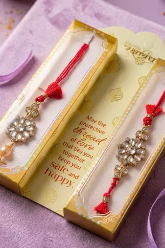 set of 2 red kundan studded floral design bhaiya bhabhi rakhi with roli chawal