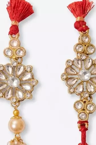 set of 2 red kundan studded floral design bhaiya bhabhi rakhi with roli chawal
