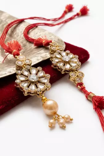 set of 2 red kundan studded floral design bhaiya bhabhi rakhi with roli chawal