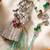 set of 2 designer religious silver toned bhaiya bhabhi rakhi with roli chawal chandan