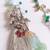 set of 2 designer religious silver toned bhaiya bhabhi rakhi with roli chawal chandan