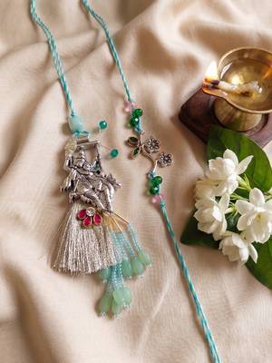 set of 2 designer religious silver toned bhaiya bhabhi rakhi with roli chawal chandan 4