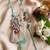 set of 2 designer religious silver toned bhaiya bhabhi rakhi with roli chawal chandan