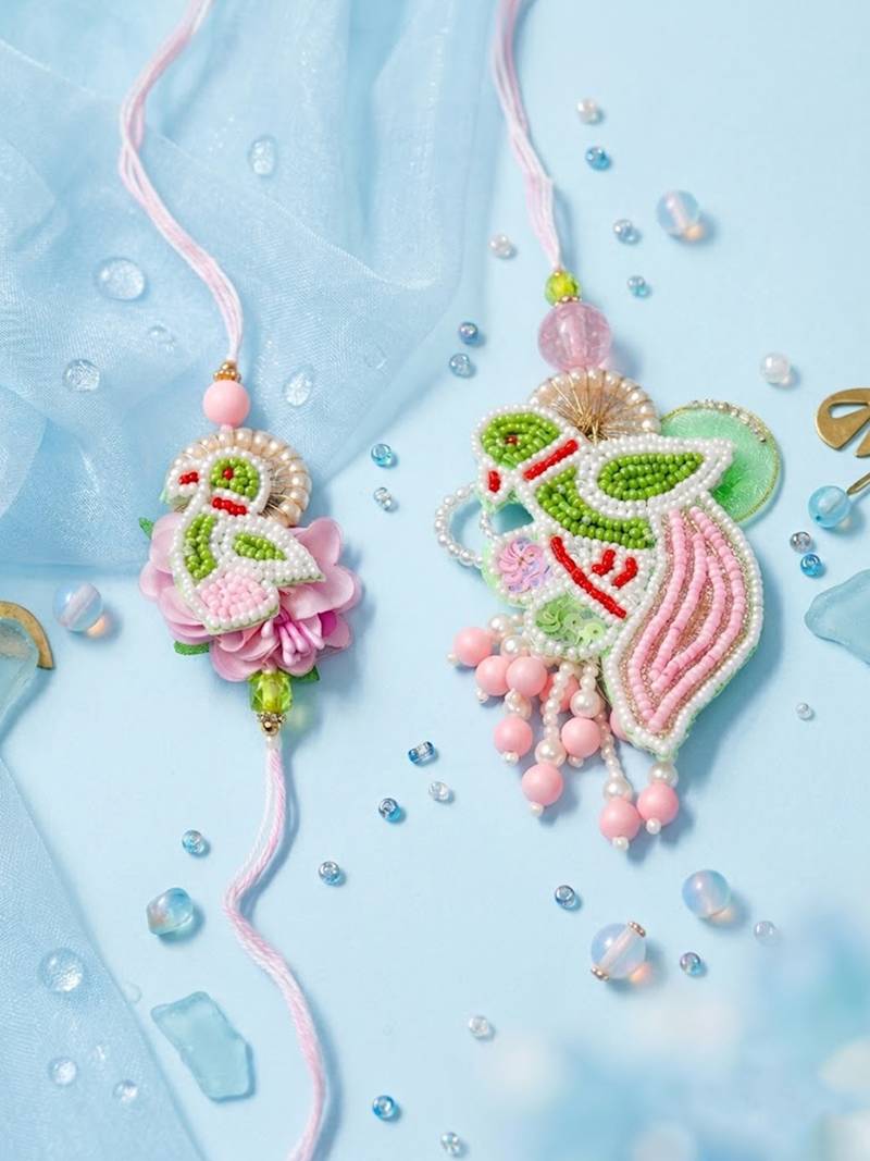 set of 2 leaf design pearls & artificial stones bhaiya bhabhi rakhi with roli chawal