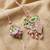 set of 2 leaf design pearls & artificial stones bhaiya bhabhi rakhi with roli chawal