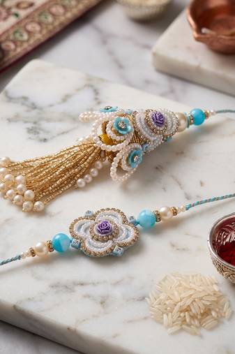 set of 2 pearls & artificial stones floral bhaiya bhabhi rakhi with roli chawal