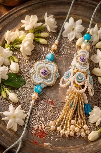 set of 2 pearls & artificial stones floral bhaiya bhabhi rakhi with roli chawal