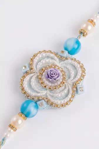 set of 2 pearls & artificial stones floral bhaiya bhabhi rakhi with roli chawal